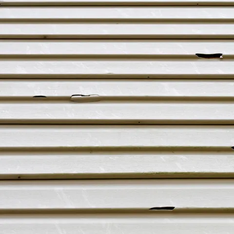 Cracked and damaged siding panels